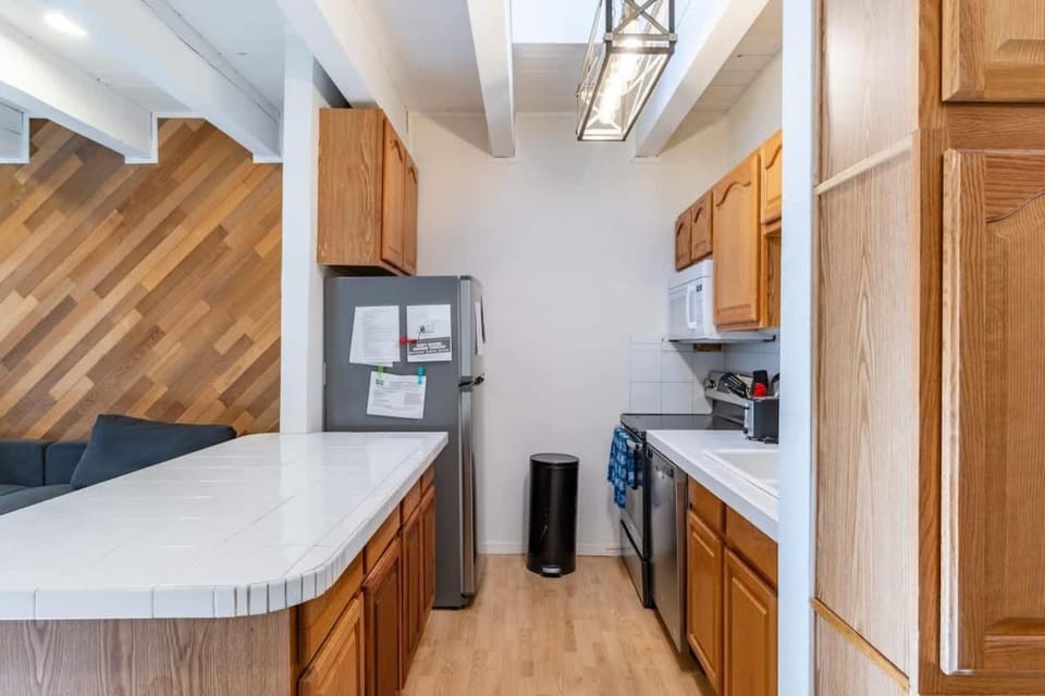 Kitchen or kitchenette, dishwasher, oven, stove