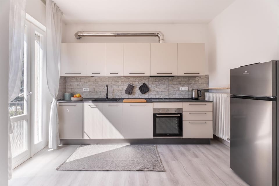 Kitchen or kitchenette, dishwasher, oven, stove, washing machine