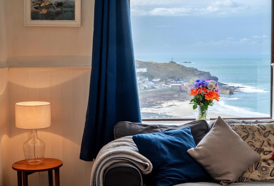 Natural landscape, View (from property/room), Living room, Seating area, Sea view