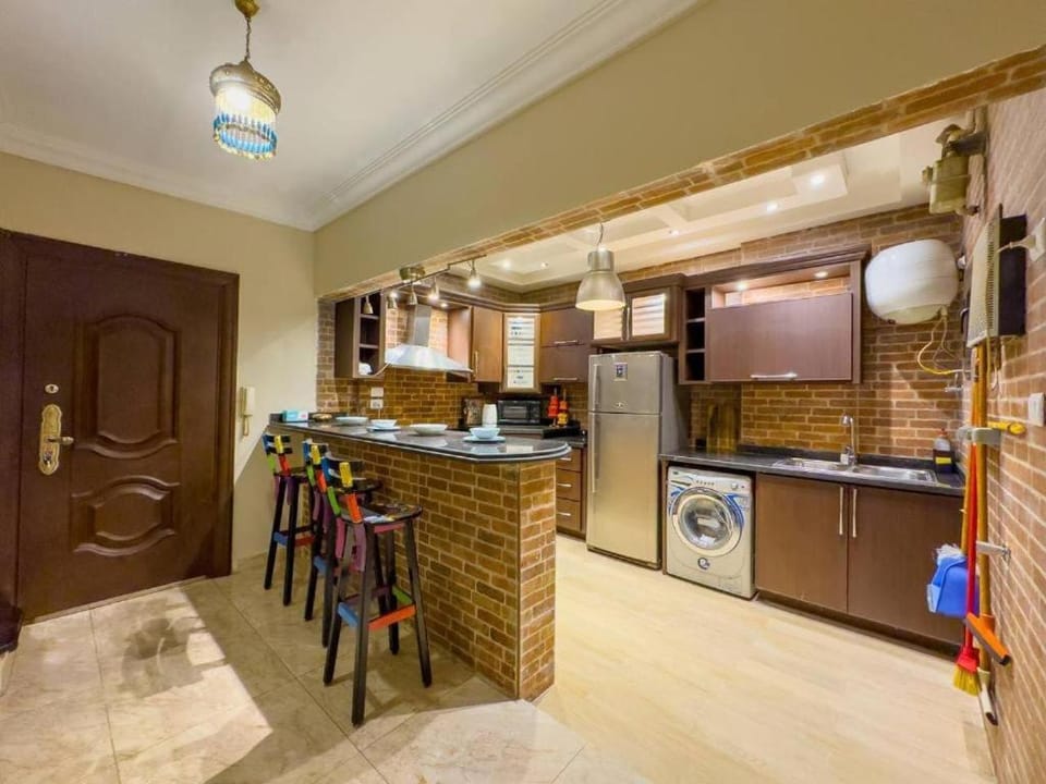 Kitchen or kitchenette, stove, washing machine
