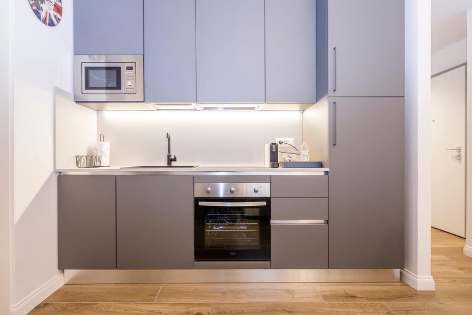 Kitchen or kitchenette, dishwasher, oven, stove