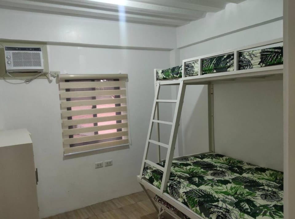 Photo of the whole room, bunk bed, air conditioner