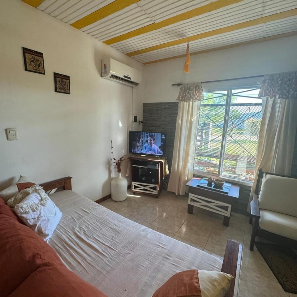Communal lounge/ TV room, Bed, TV and multimedia, Living room, Photo of the whole room, Seating area, Evening entertainment, Bedroom, air conditioner