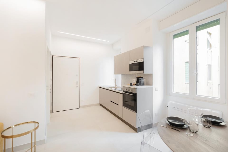 Kitchen or kitchenette, dishwasher, oven, stove
