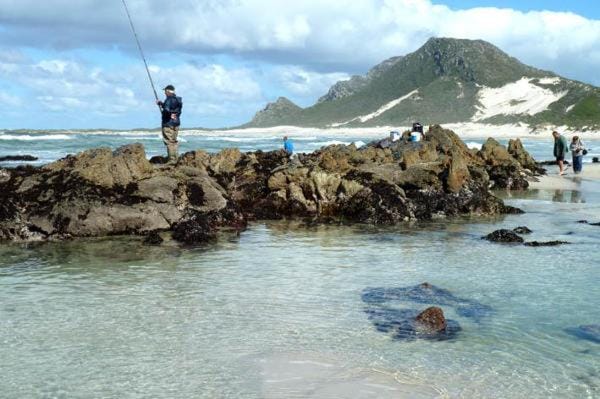 Nearby landmark, Day, People, Natural landscape, Fishing, Beach, Mountain view, Sea view