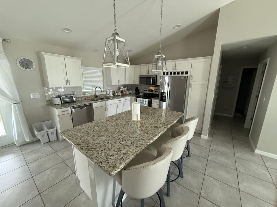 Kitchen or kitchenette, dishwasher, oven, stove