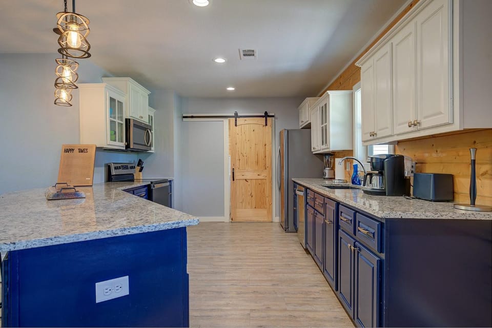 Kitchen or kitchenette, dishwasher, oven, stove