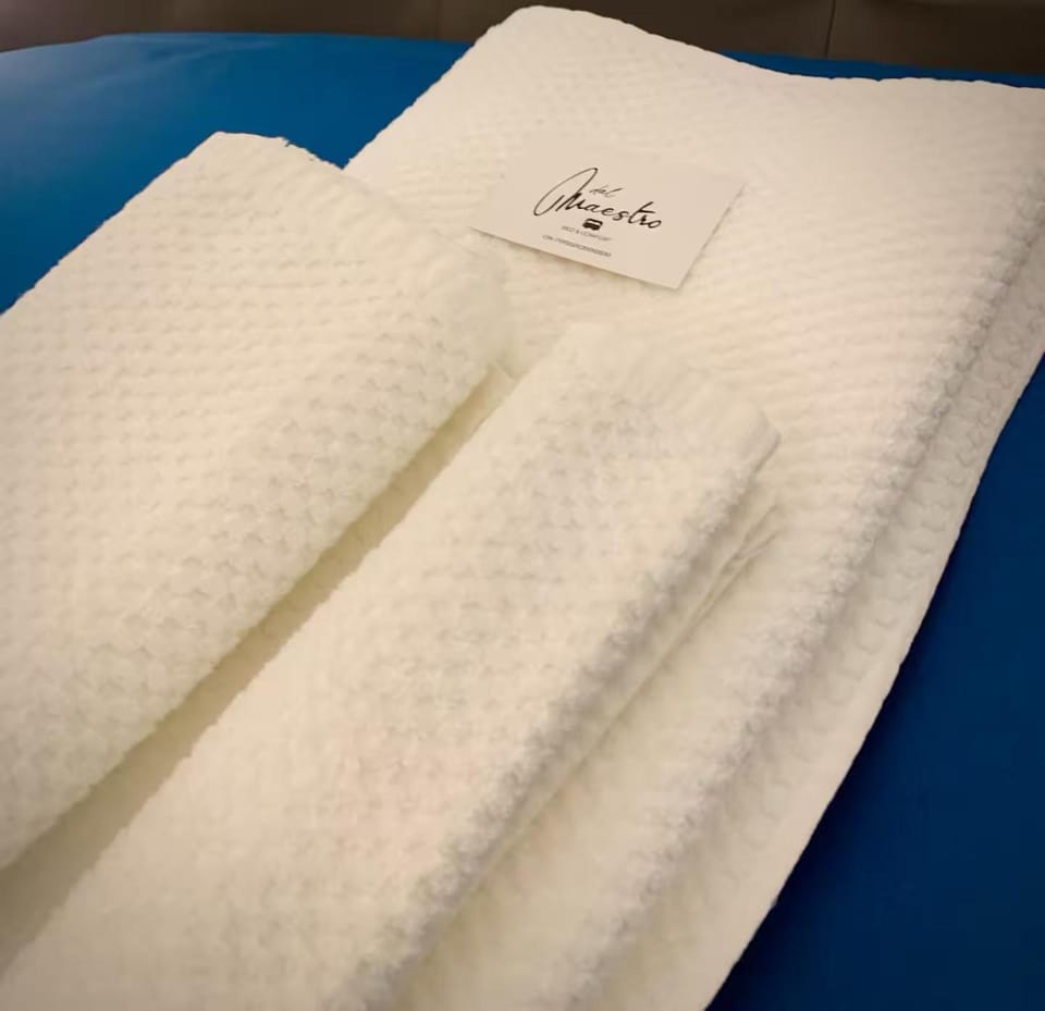 Bed, Property logo or sign, Bedroom, towels, towels