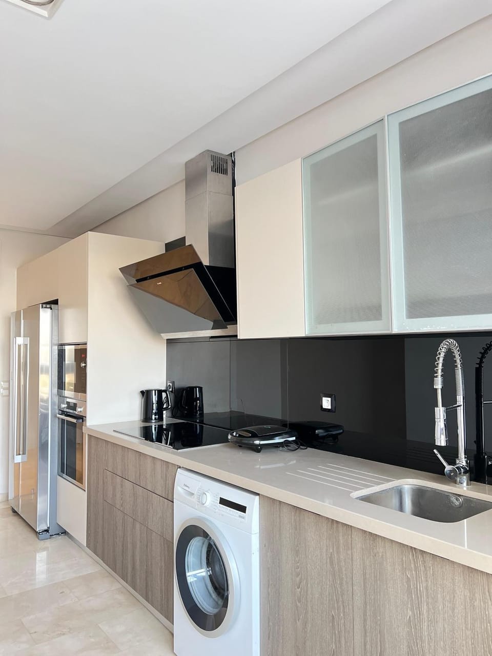 Kitchen or kitchenette, dishwasher, oven, stove, washing machine, dryer