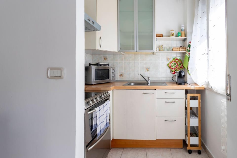 Kitchen or kitchenette, dishwasher, oven, stove, toaster