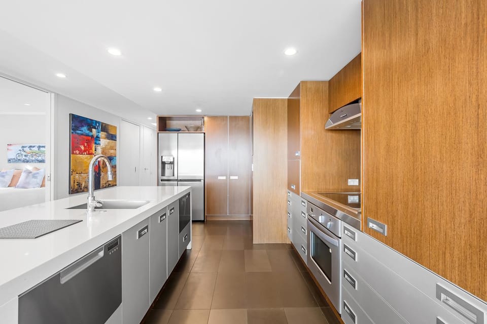 Kitchen or kitchenette, dishwasher, oven, stove