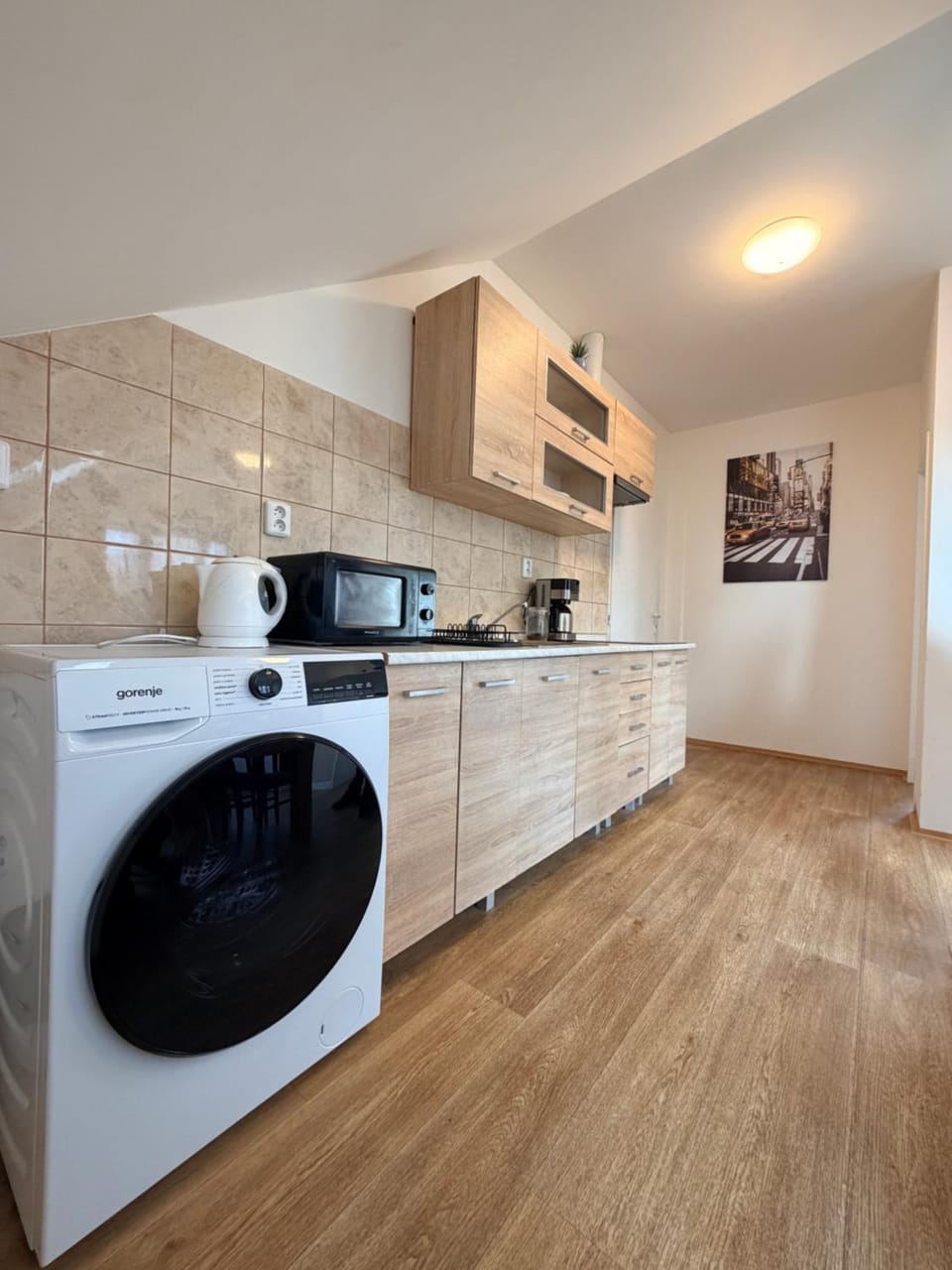Kitchen or kitchenette, stove, washing machine, dryer
