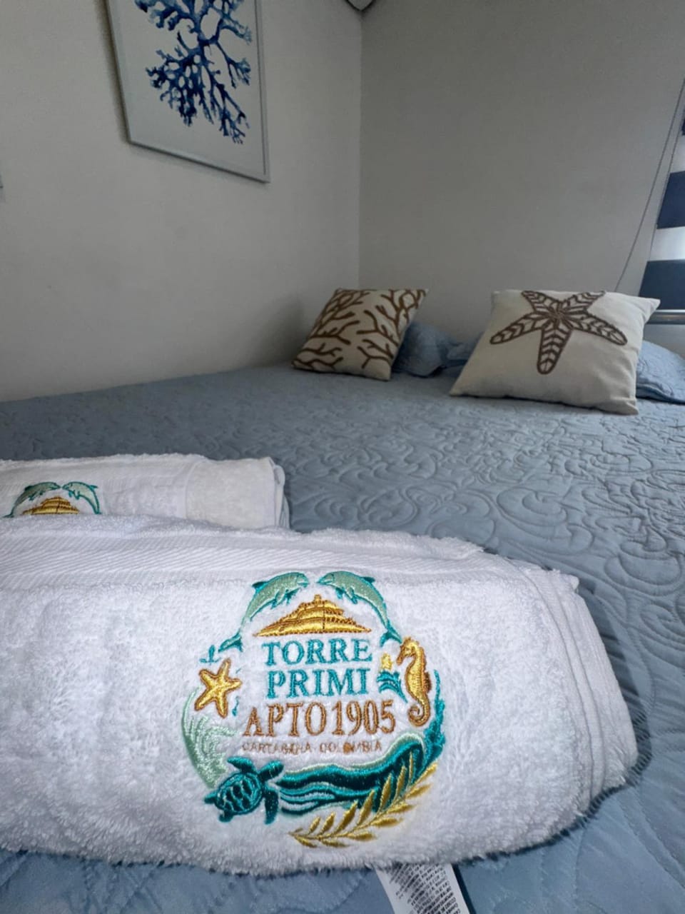 Bed, Property logo or sign, towels