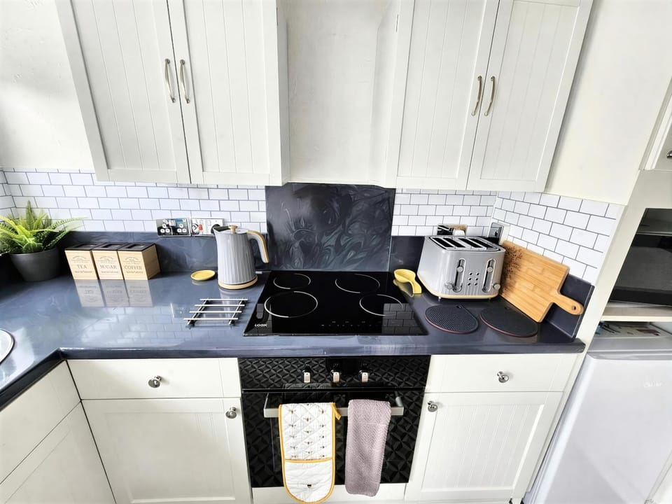 Kitchen or kitchenette, stove, toaster