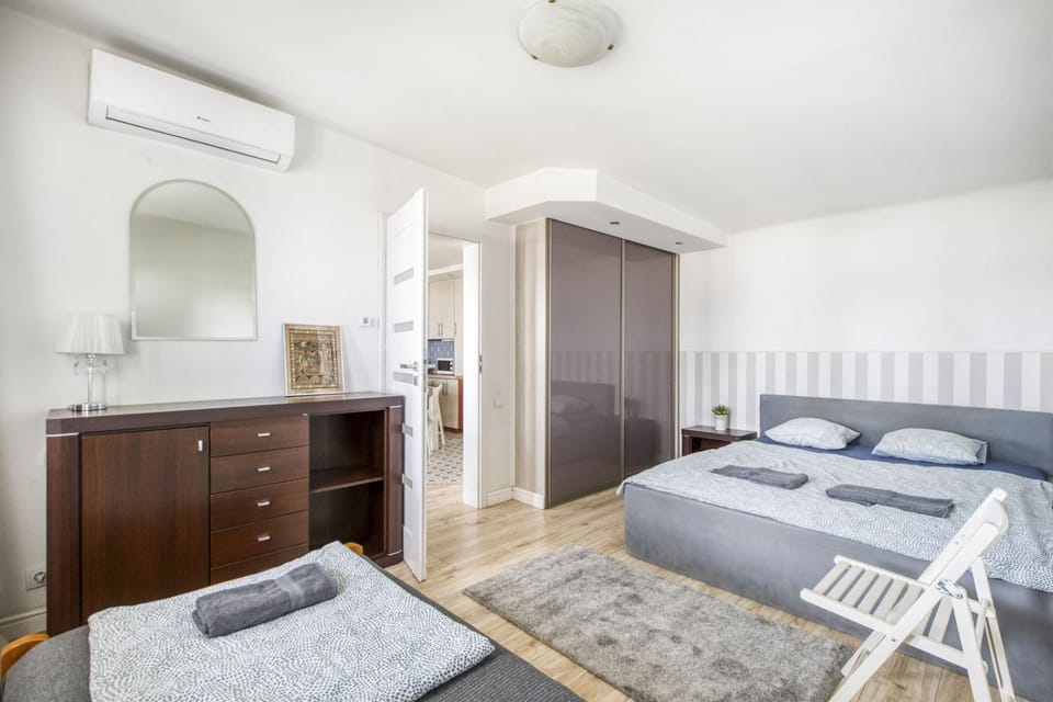 Bed, Photo of the whole room, Seating area, Bedroom, towels, wardrobe, air conditioner