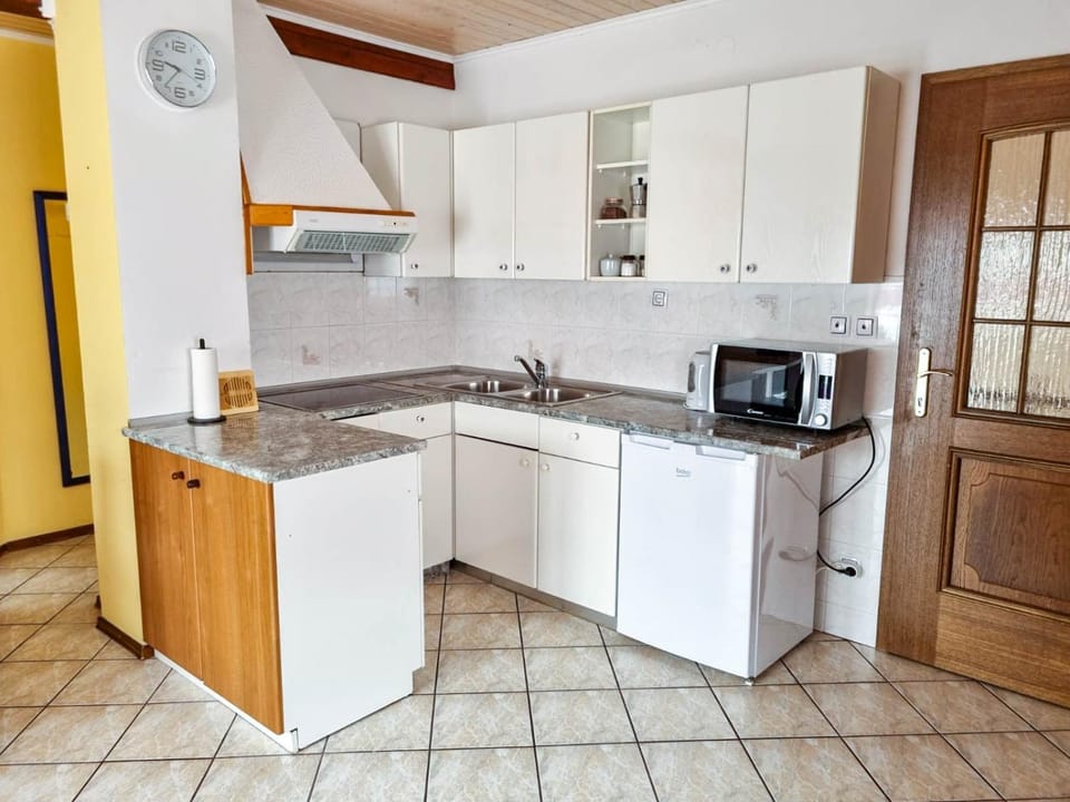 Kitchen or kitchenette, stove, toaster