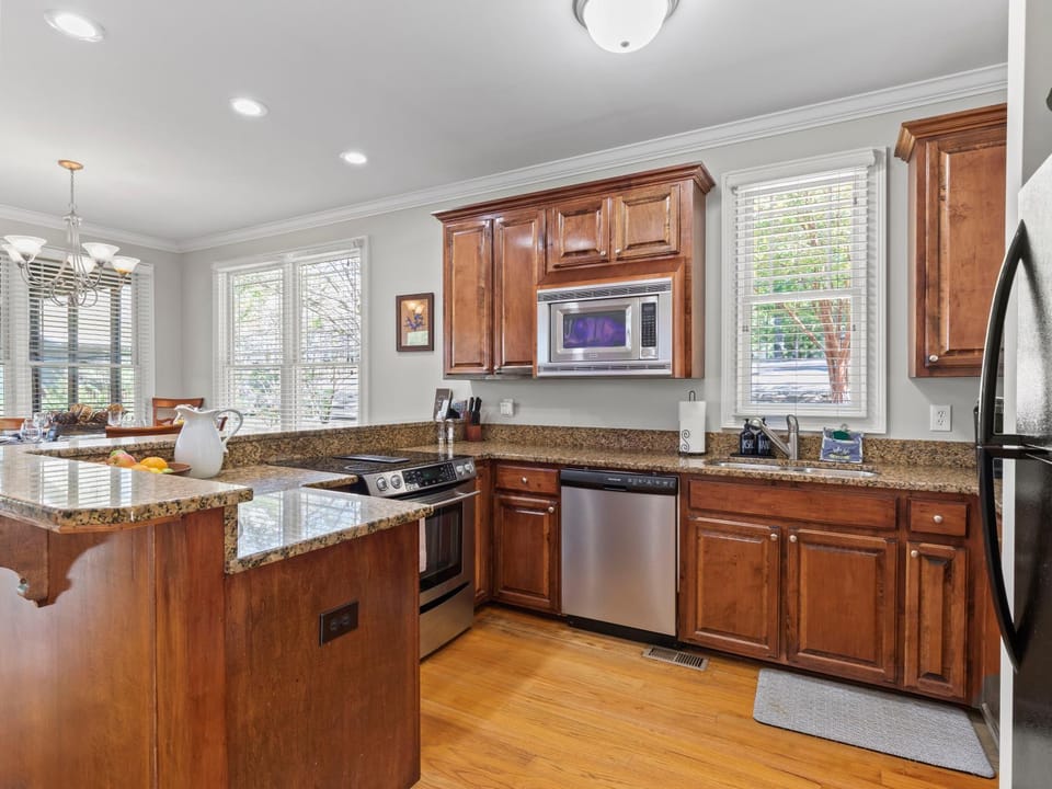 Kitchen or kitchenette, dishwasher, oven, stove
