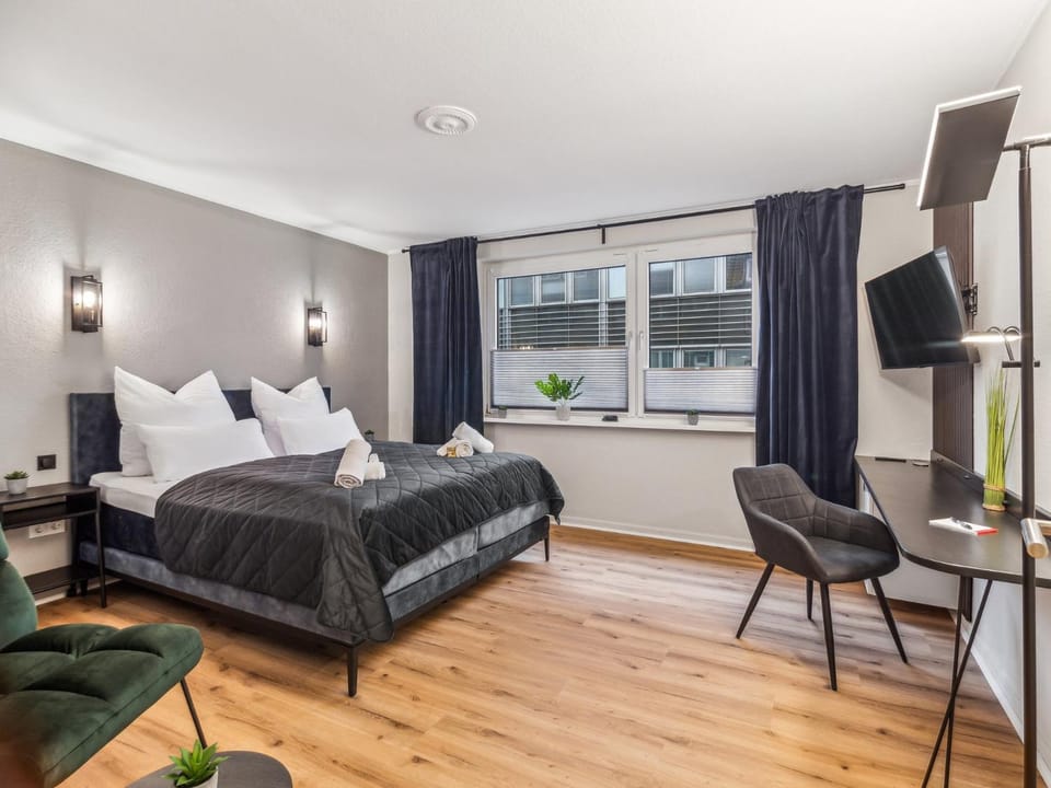 Bed, TV and multimedia, Living room, Seating area, Bedroom
