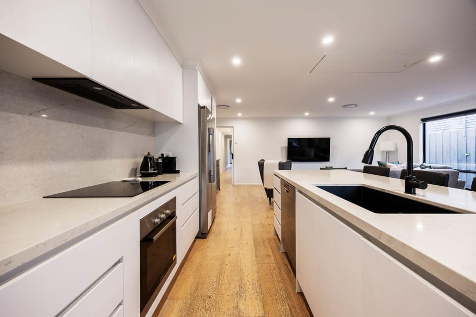 Kitchen or kitchenette, dishwasher, oven, stove