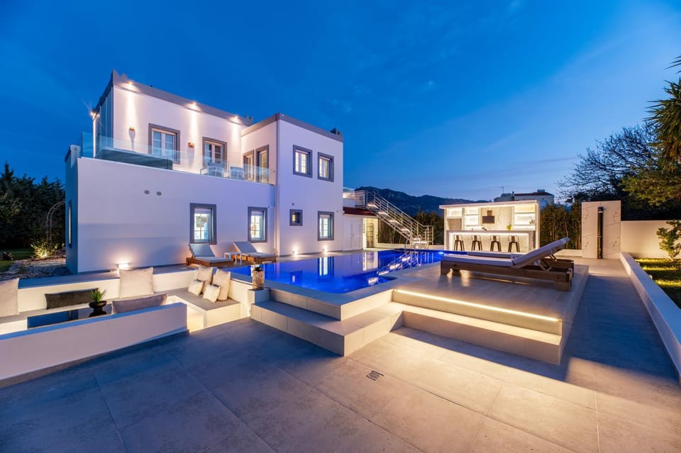 Property building, Patio, Night, View (from property/room), Balcony/Terrace, Living room, Seating area, Pool view, Swimming pool, sunbed