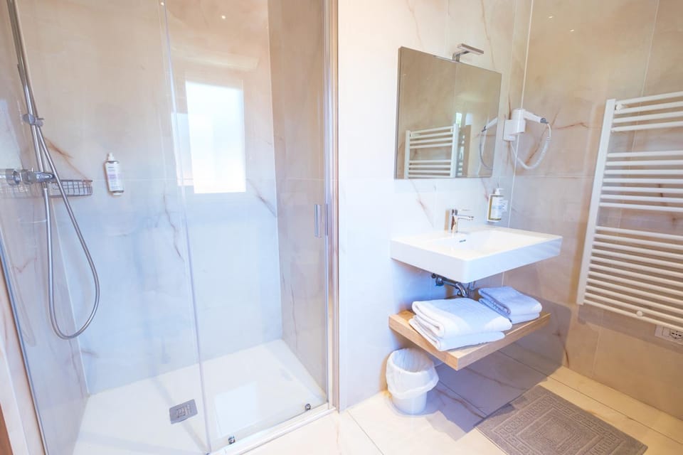 Shower, Bathroom, hair dryier, towels