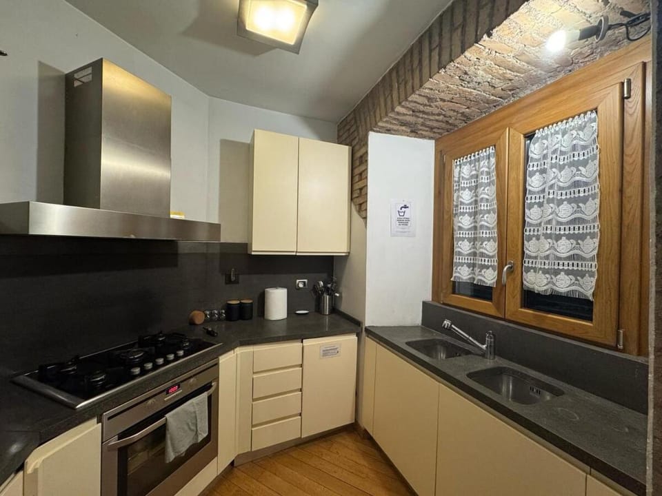 Kitchen or kitchenette, dishwasher, oven, stove