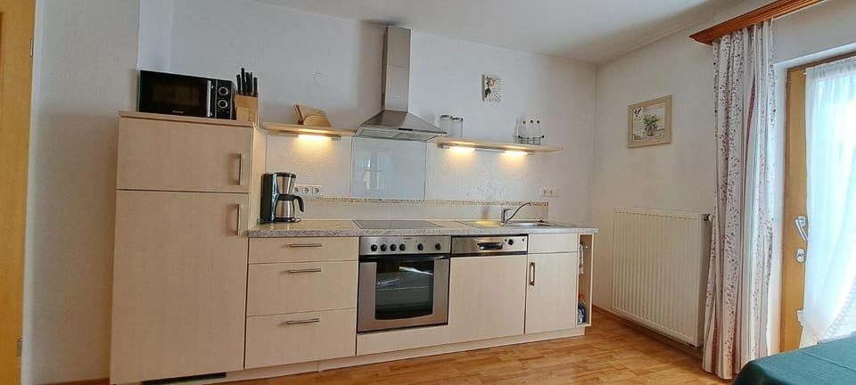 Kitchen or kitchenette, oven, stove, toaster