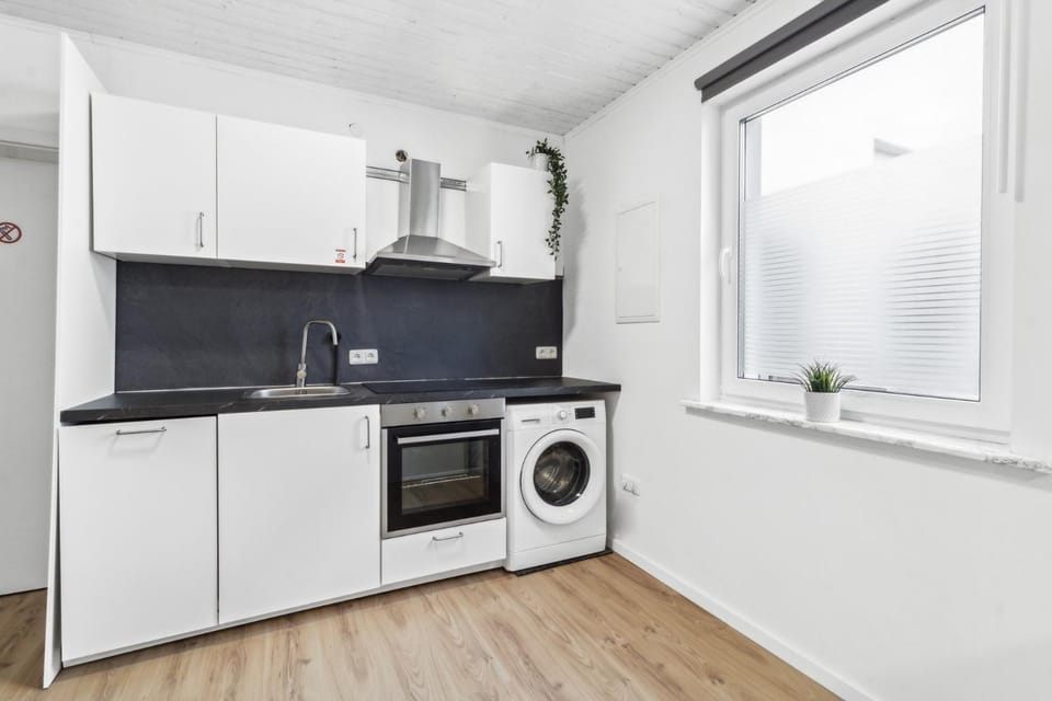 Kitchen or kitchenette, dishwasher, oven, stove, washing machine, dryer