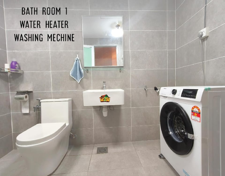 Toilet, Bathroom, hair dryier, towels, washing machine
