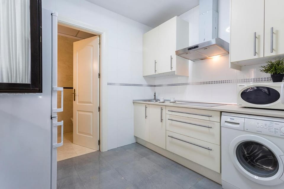 Kitchen or kitchenette, stove, washing machine