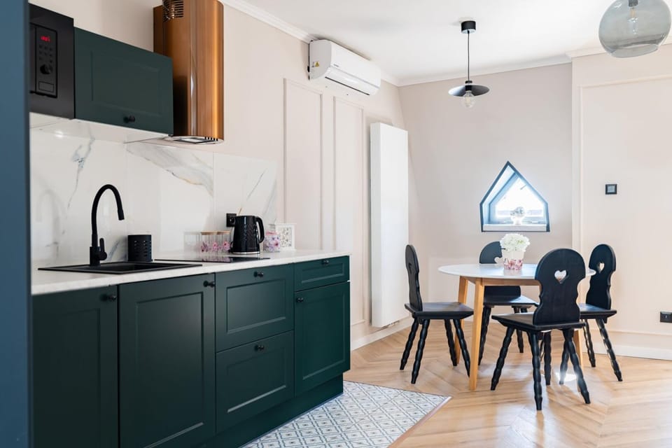 Kitchen or kitchenette, stove, air conditioner