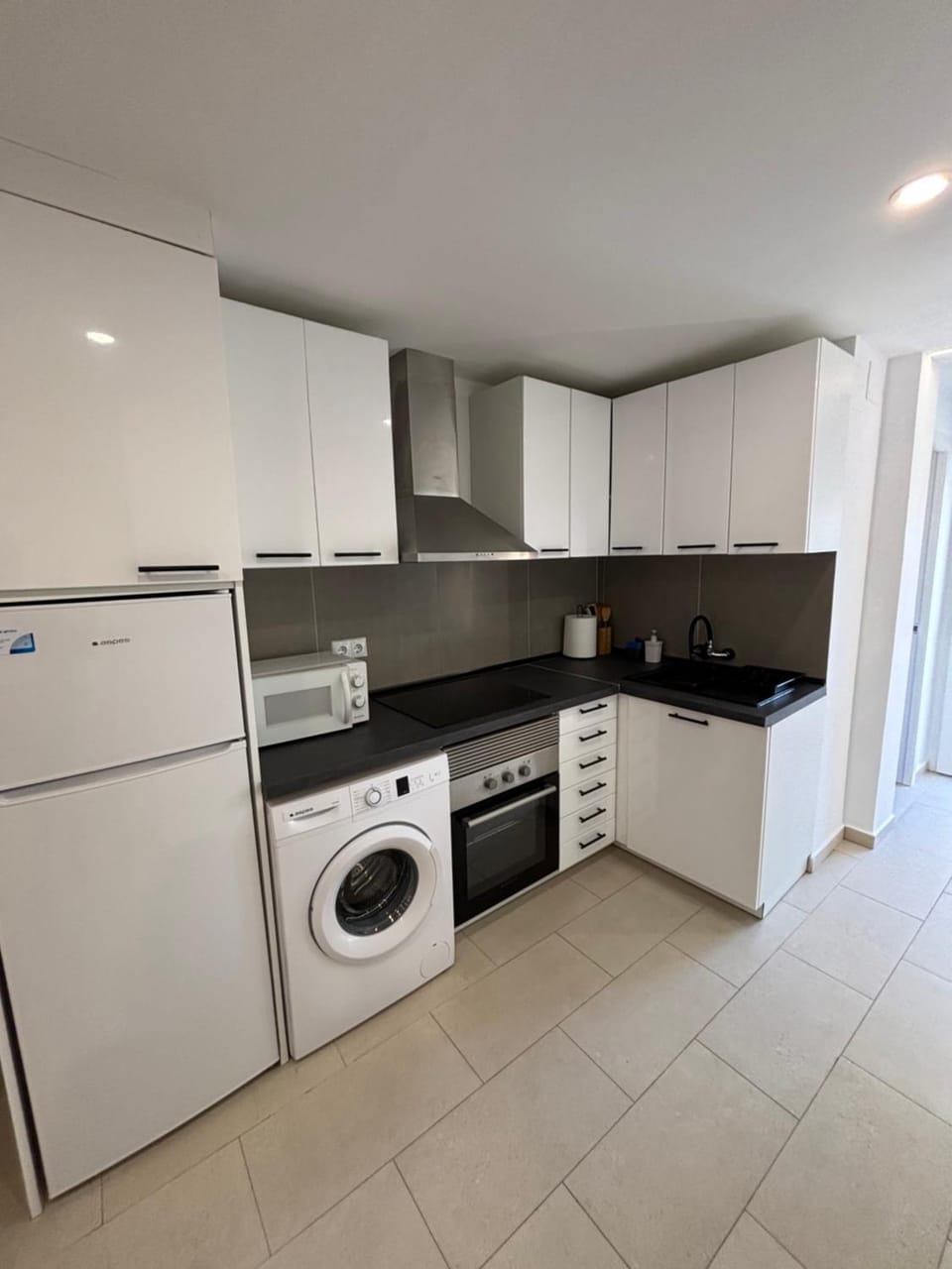 Kitchen or kitchenette, oven, stove, washing machine