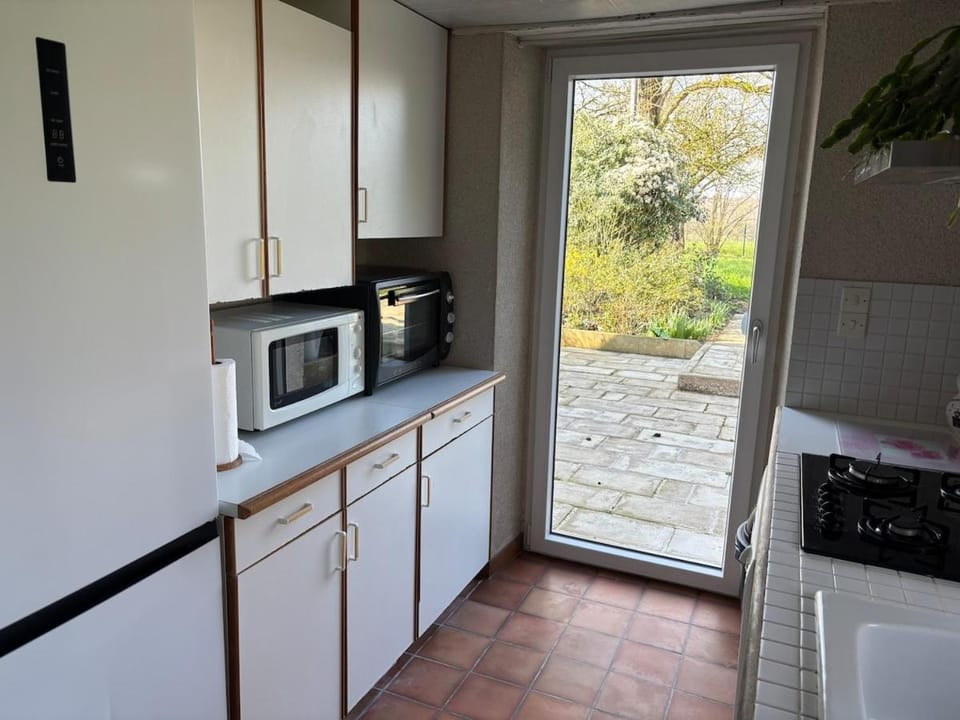 Kitchen or kitchenette, dishwasher, oven, stove, toaster