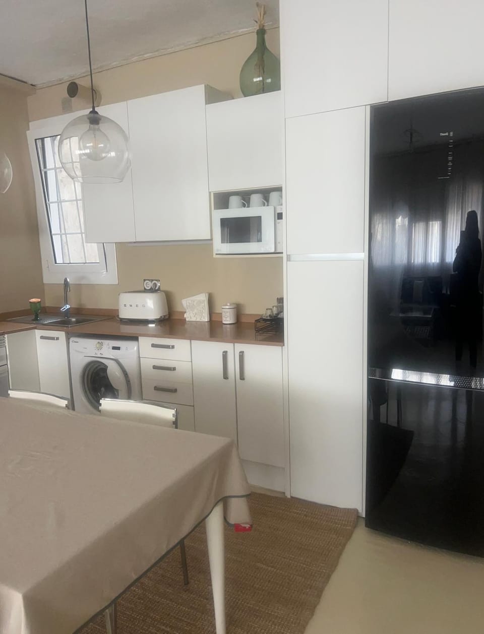 Kitchen or kitchenette, Dining area, oven, stove, toaster, washing machine