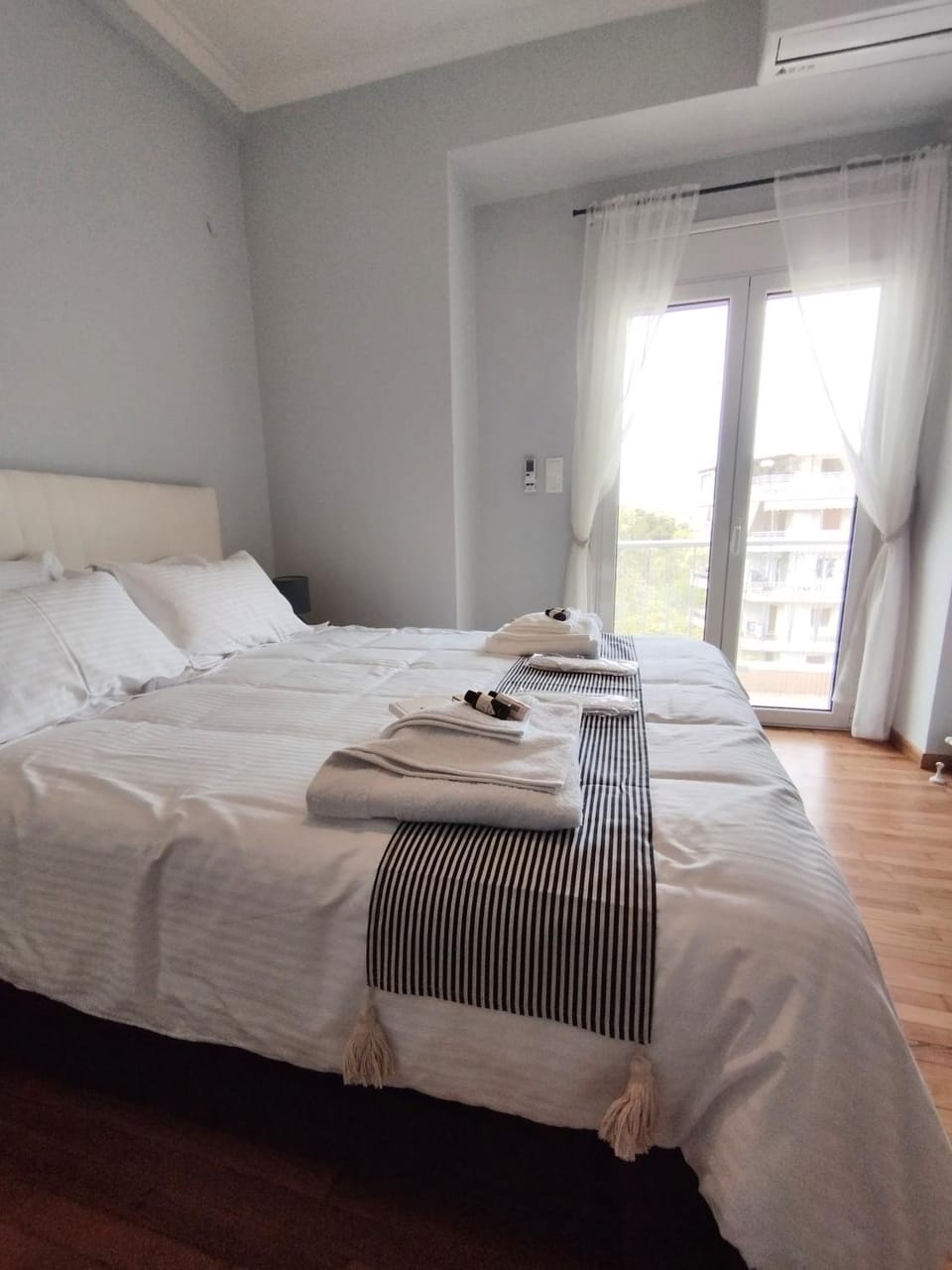 Bed, View (from property/room), Balcony/Terrace, Decorative detail, Bedroom, furniture, towels, air conditioner