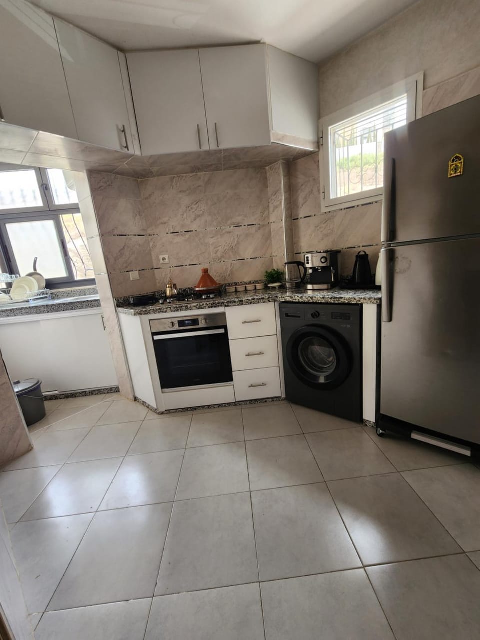 Kitchen or kitchenette, oven, stove, washing machine, dryer