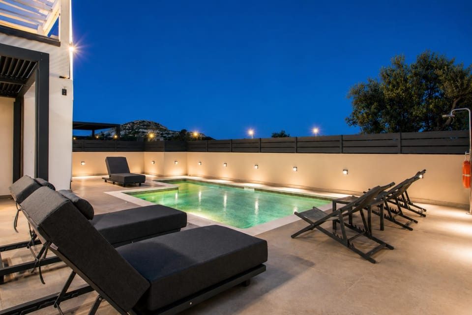 Patio, Night, Pool view, Swimming pool, sunbed