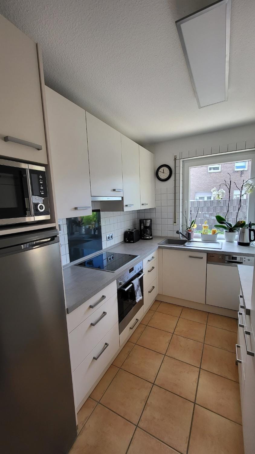 Kitchen or kitchenette, dishwasher, oven, stove, toaster
