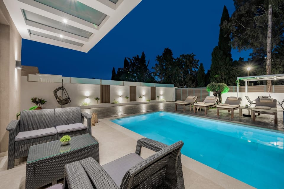Patio, Night, Natural landscape, Living room, Seating area, Pool view, Swimming pool, sunbed