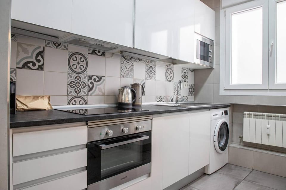 Kitchen or kitchenette, microwave, oven, stove, washing machine