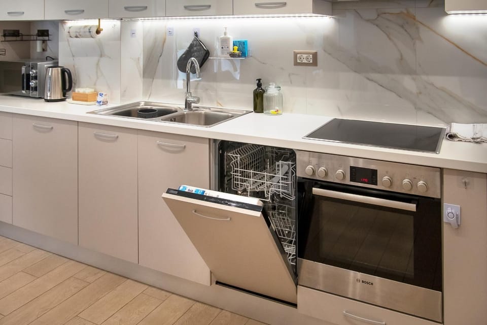 Kitchen or kitchenette, dishwasher, oven, stove