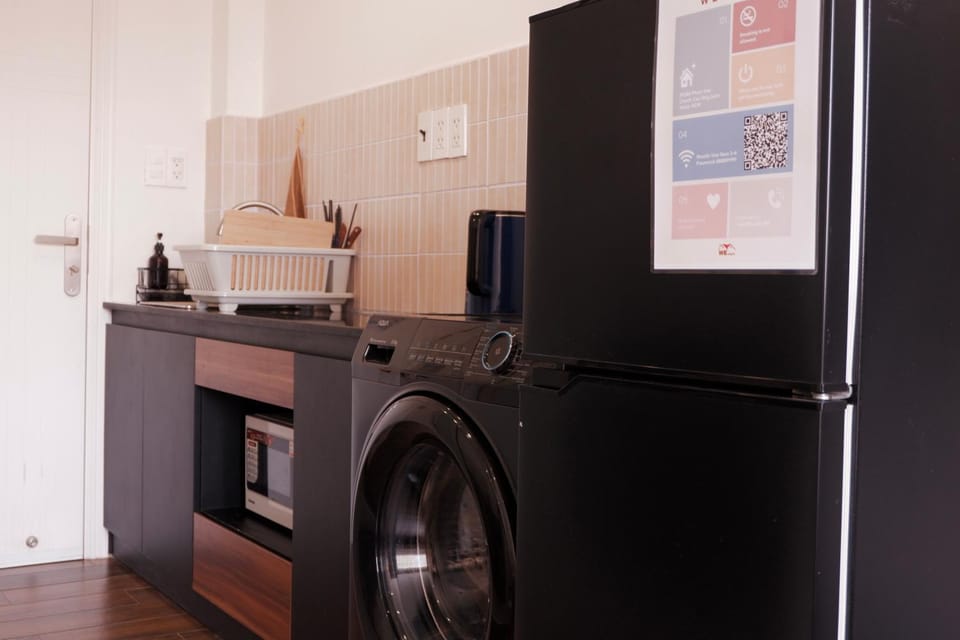 Kitchen or kitchenette, stove, stove, laundry, laundry, laundry, washing machine, washing machine, washing machine, kitchen, kitchen