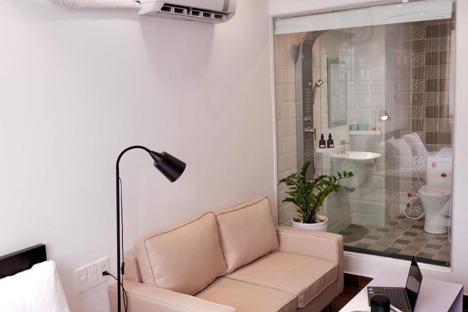 Shower, Bathroom, Living room, Seating area, towels, air conditioner