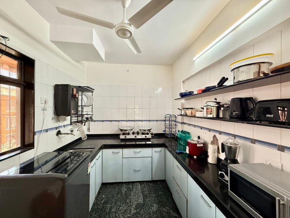 Kitchen or kitchenette, stove, toaster