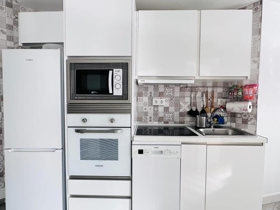 Kitchen or kitchenette, dishwasher, oven, stove, toaster