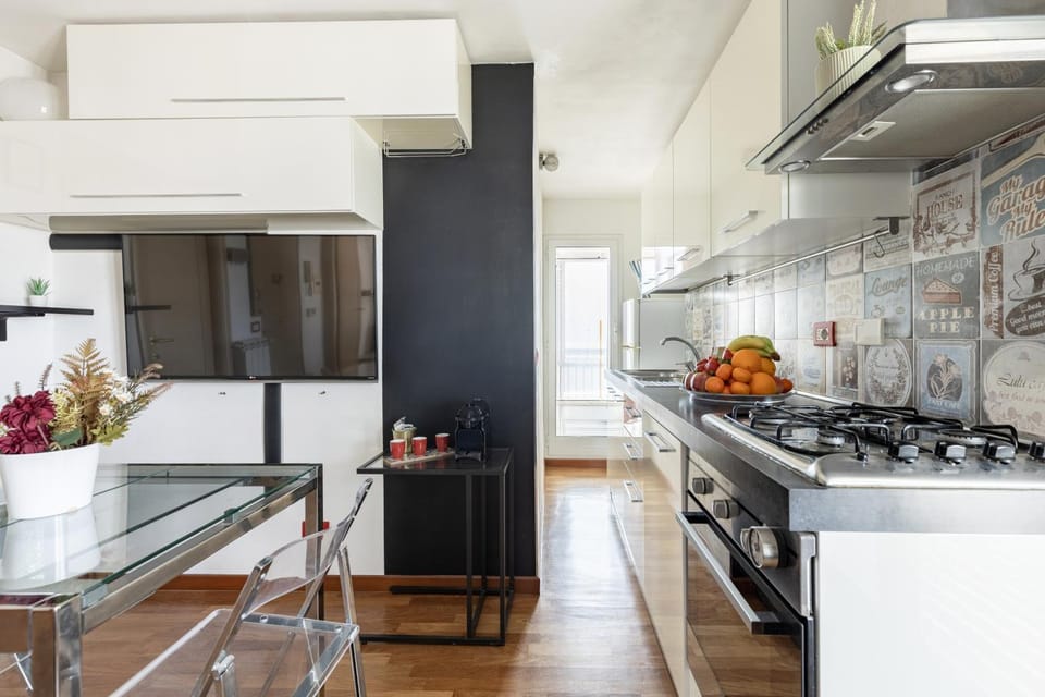 Kitchen or kitchenette, dishwasher, oven, stove
