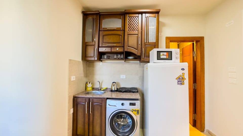 Kitchen or kitchenette, washing machine