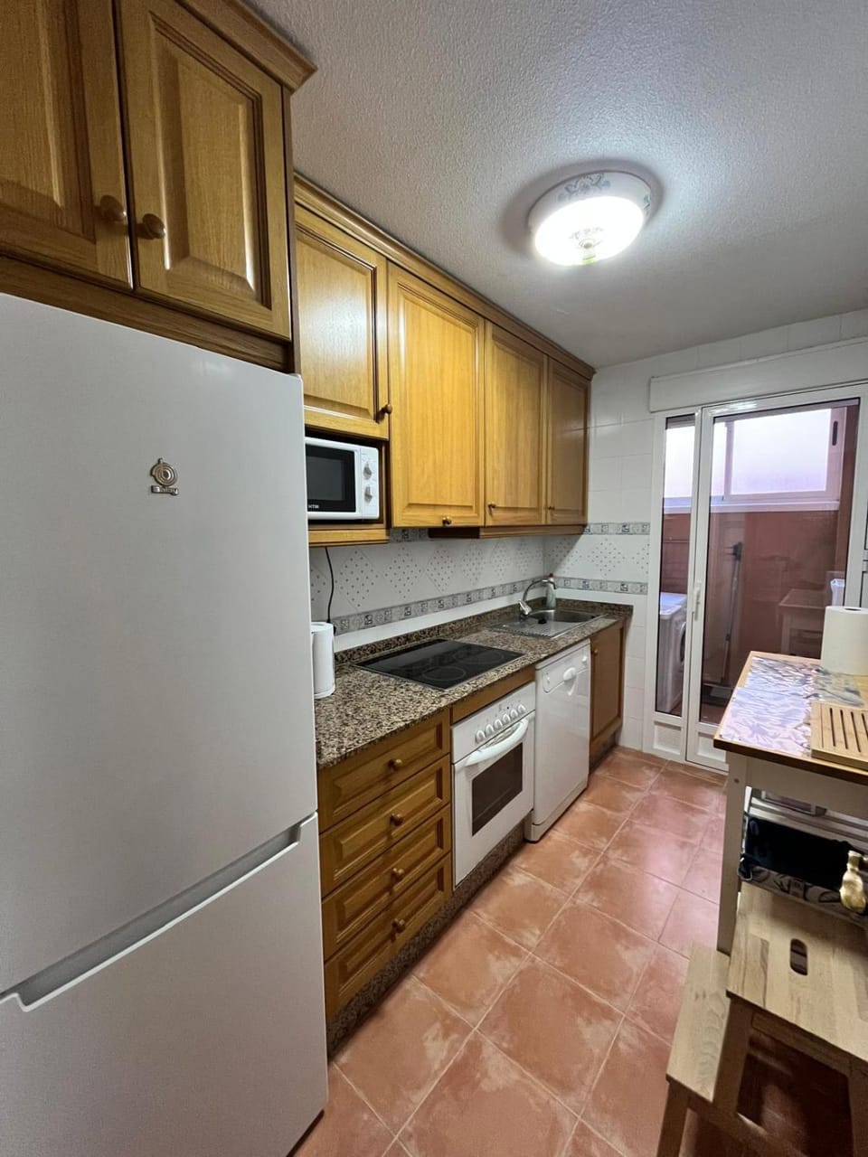 Kitchen or kitchenette, dishwasher, oven, stove, toaster