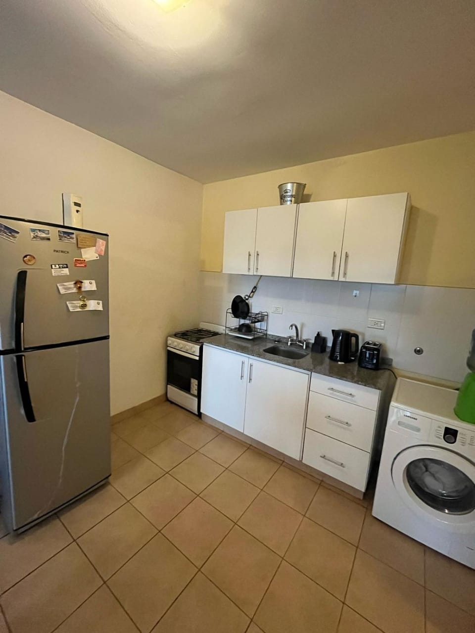 Kitchen or kitchenette, washing machine