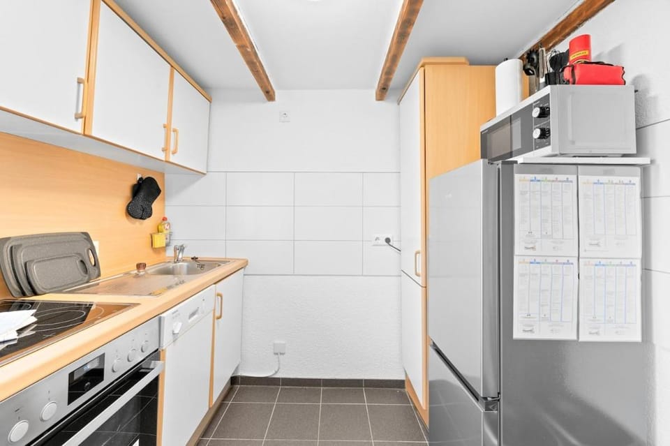 Kitchen or kitchenette, dishwasher, oven, stove